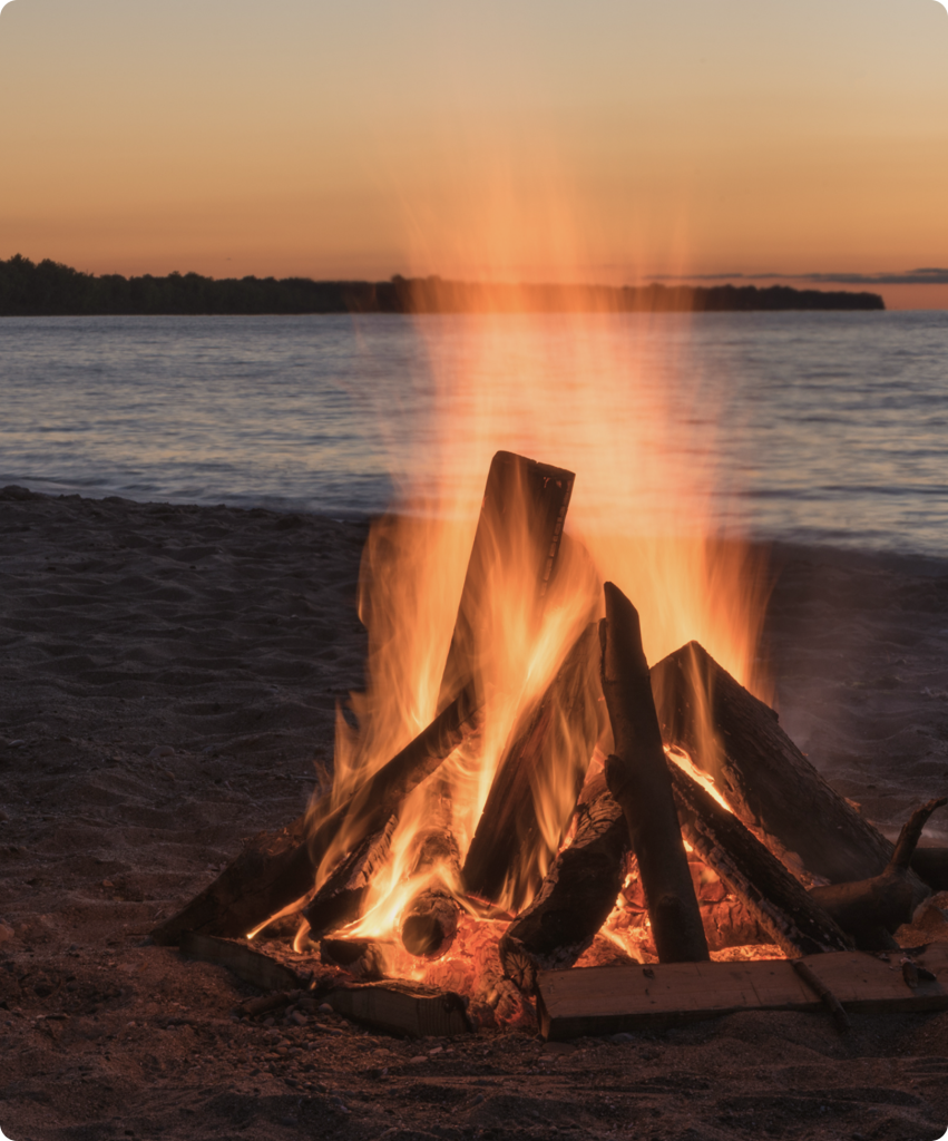 Bonfire on the beach at sunset