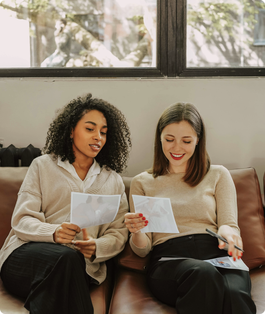Women reviewing ideas during meeting